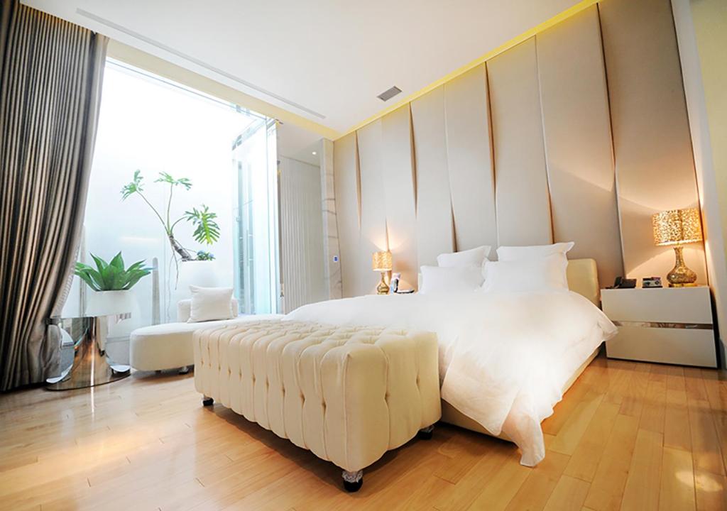 Postel nebo postele na pokoji v ubytování Royal Group Motel Ming Zu Branch