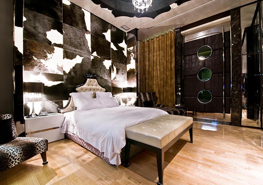 Postel nebo postele na pokoji v ubytování Royal Group Motel Ming Zu Branch