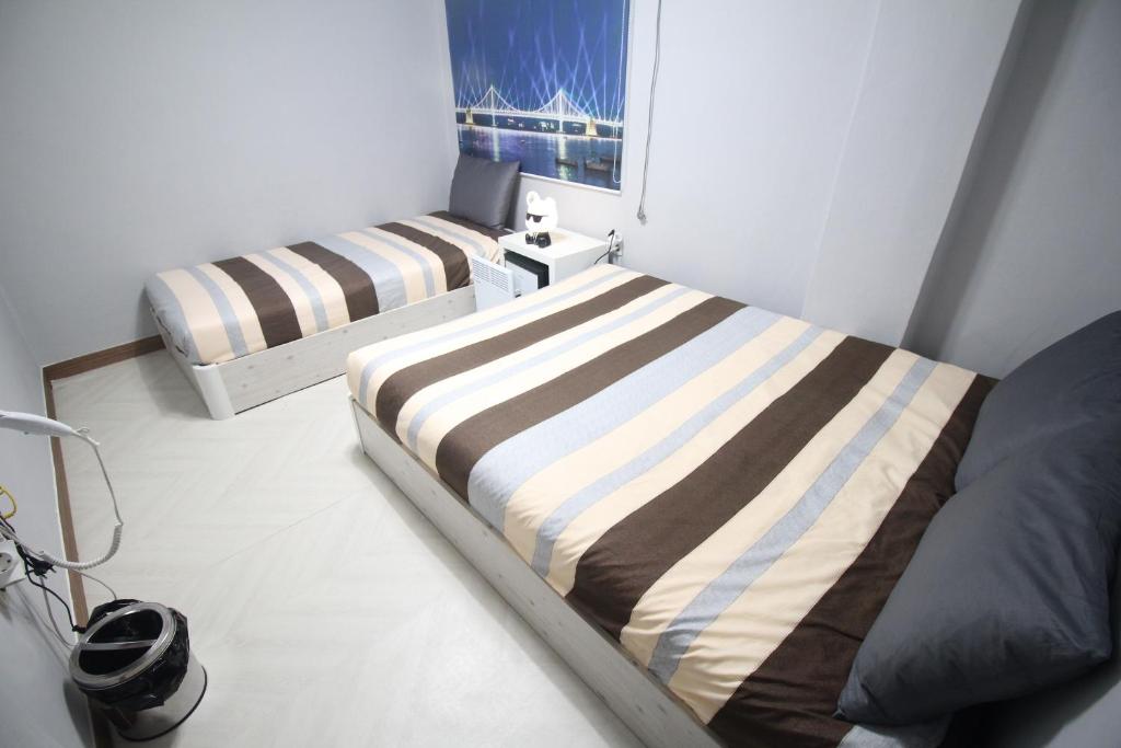 Postel nebo postele na pokoji v ubytování 24Guesthouse Seomyeon