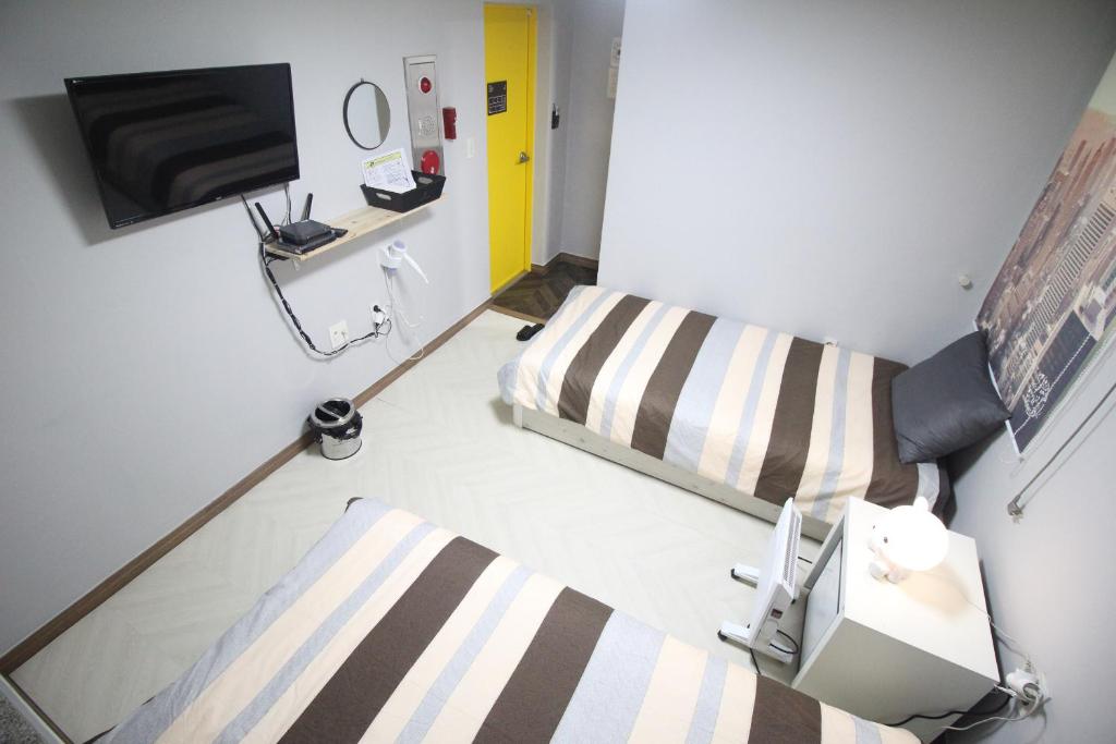 Postel nebo postele na pokoji v ubytování 24Guesthouse Seomyeon