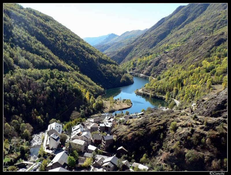 an aerial view of a village in a valley with a river at Casa Feliu in Tavascan