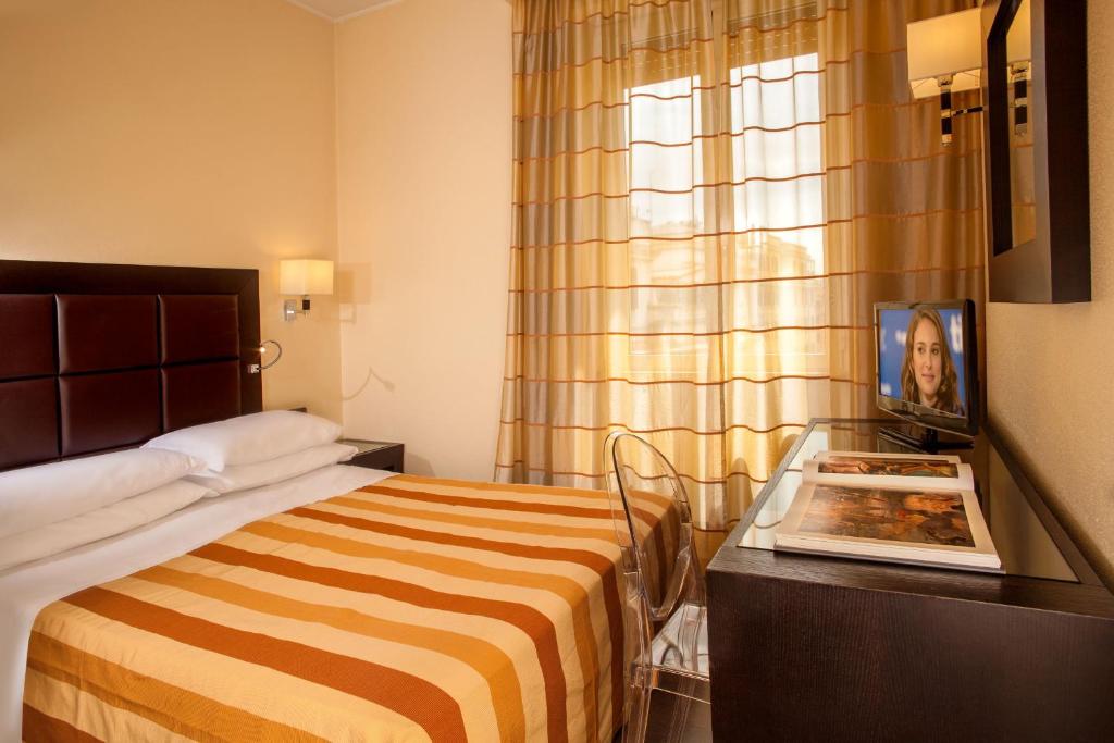 Postel nebo postele na pokoji v ubytování Hotel Buenos Aires