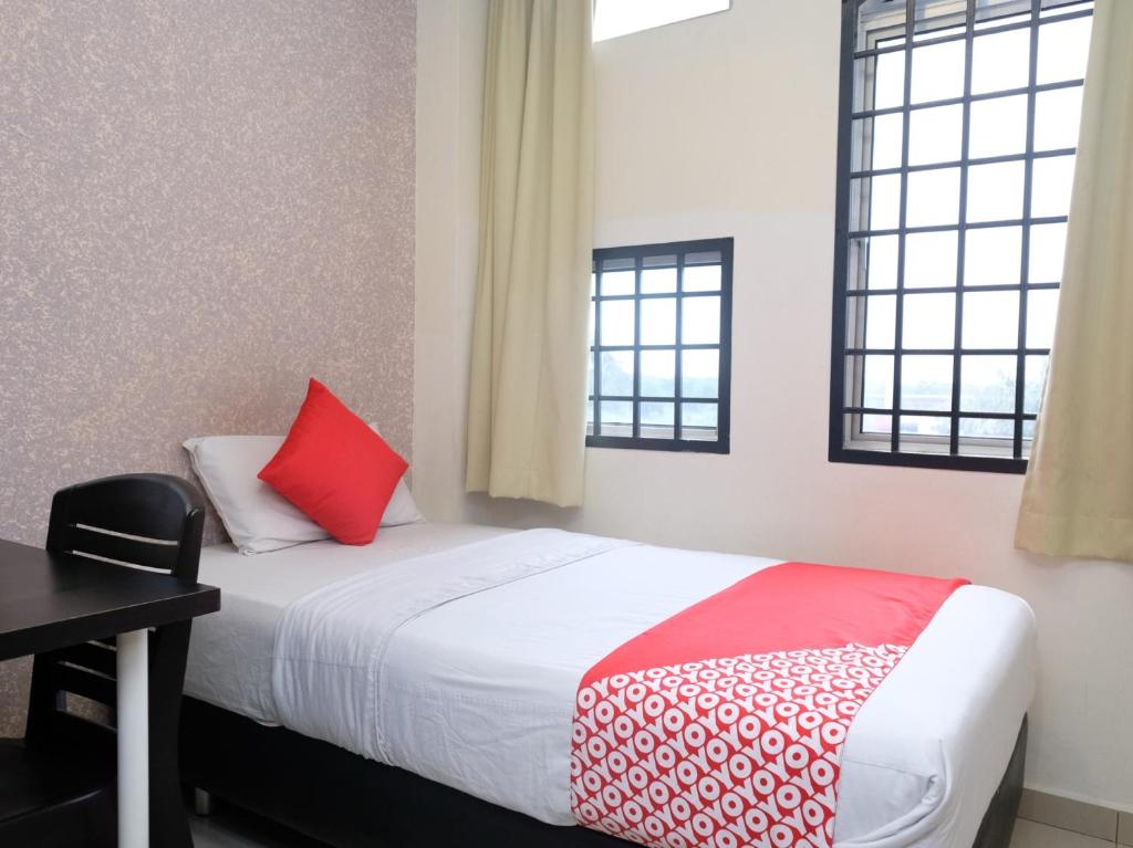 Postel nebo postele na pokoji v ubytování Hotel De' Tees, Masai Utama