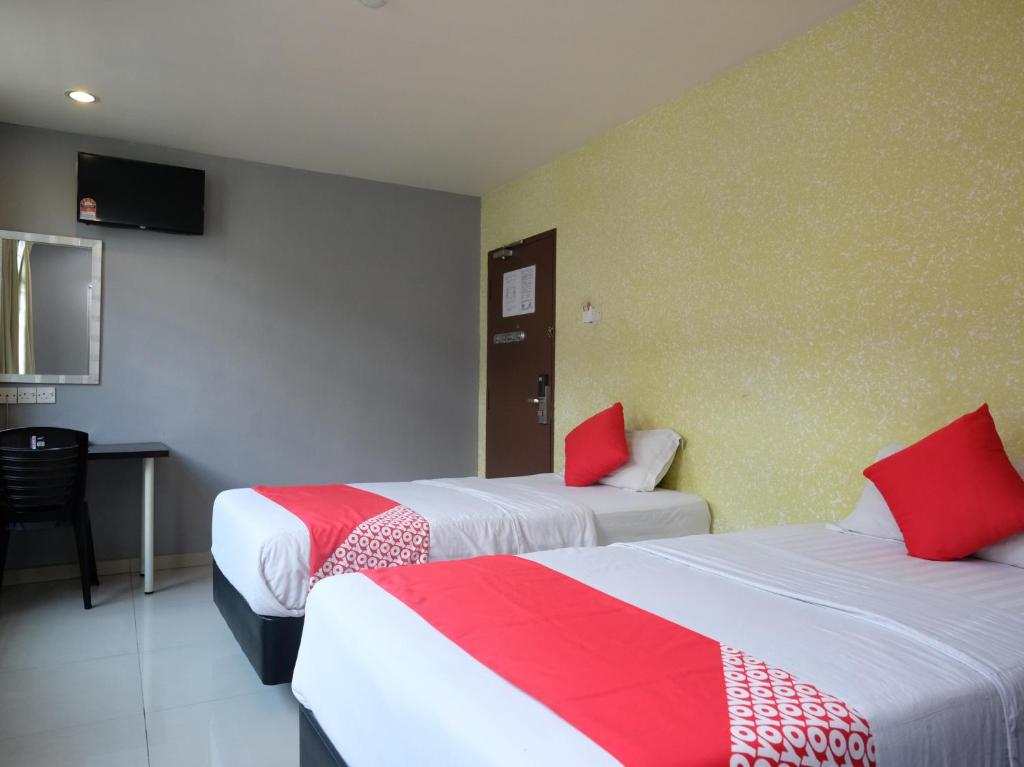 Postel nebo postele na pokoji v ubytování Hotel De' Tees, Masai Utama