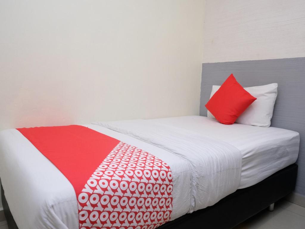 Postel nebo postele na pokoji v ubytování Hotel De' Tees, Masai Utama