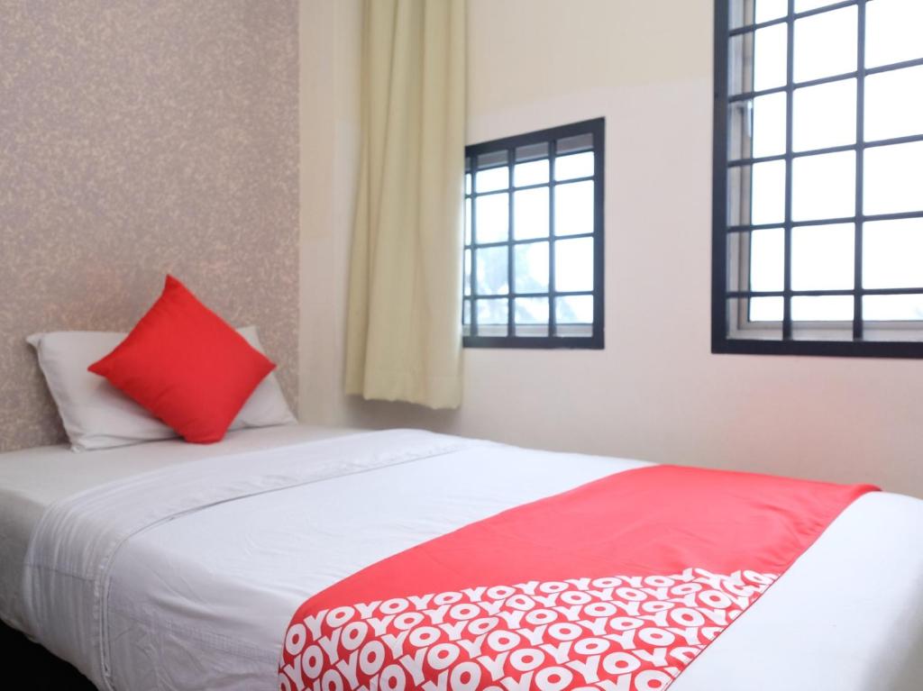 Postel nebo postele na pokoji v ubytování Hotel De' Tees, Masai Utama