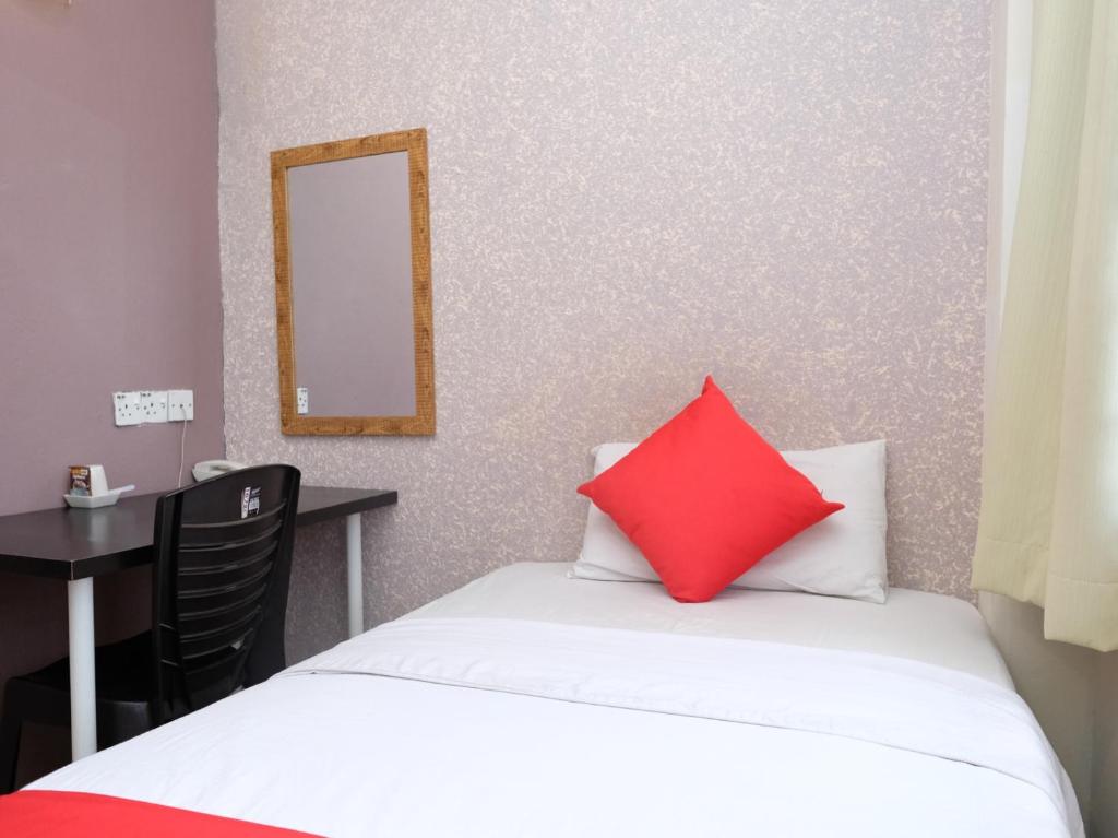 Postel nebo postele na pokoji v ubytování Hotel De' Tees, Masai Utama