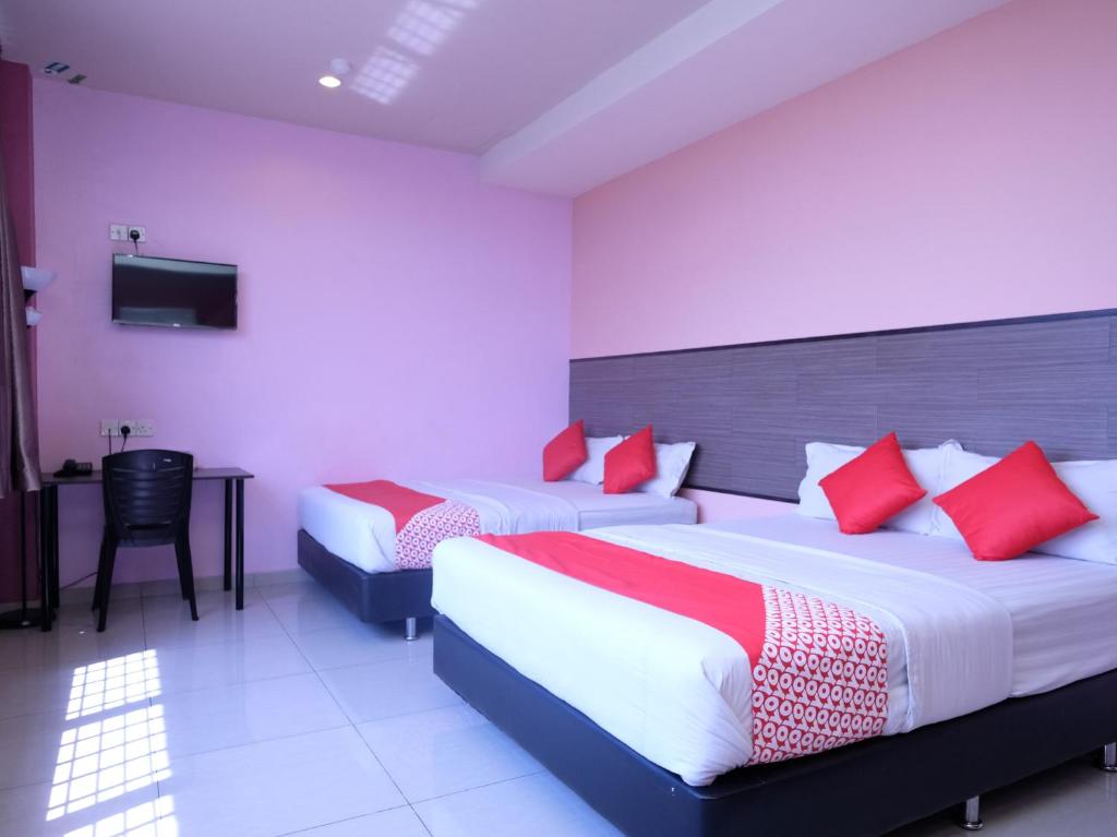 Postel nebo postele na pokoji v ubytování Hotel De' Tees, Masai Utama