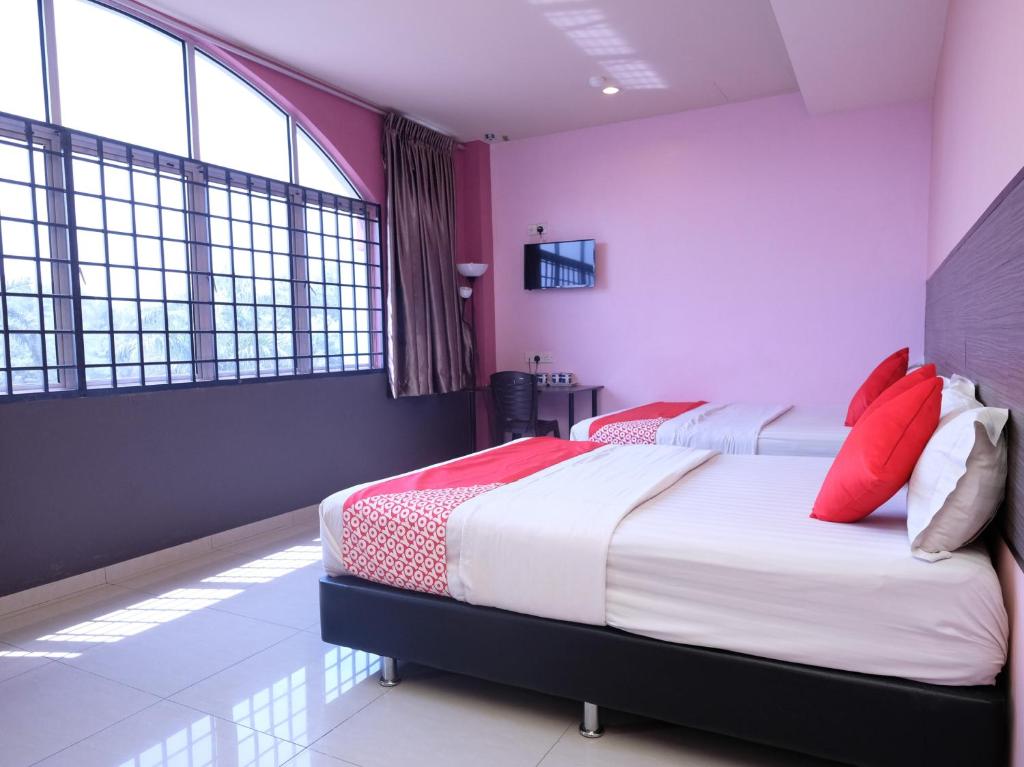 Postel nebo postele na pokoji v ubytování Hotel De' Tees, Masai Utama