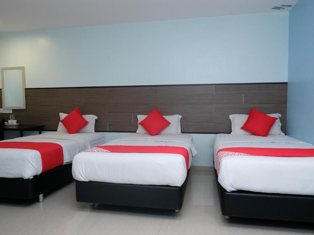 Postel nebo postele na pokoji v ubytování Hotel De' Tees, Masai Utama