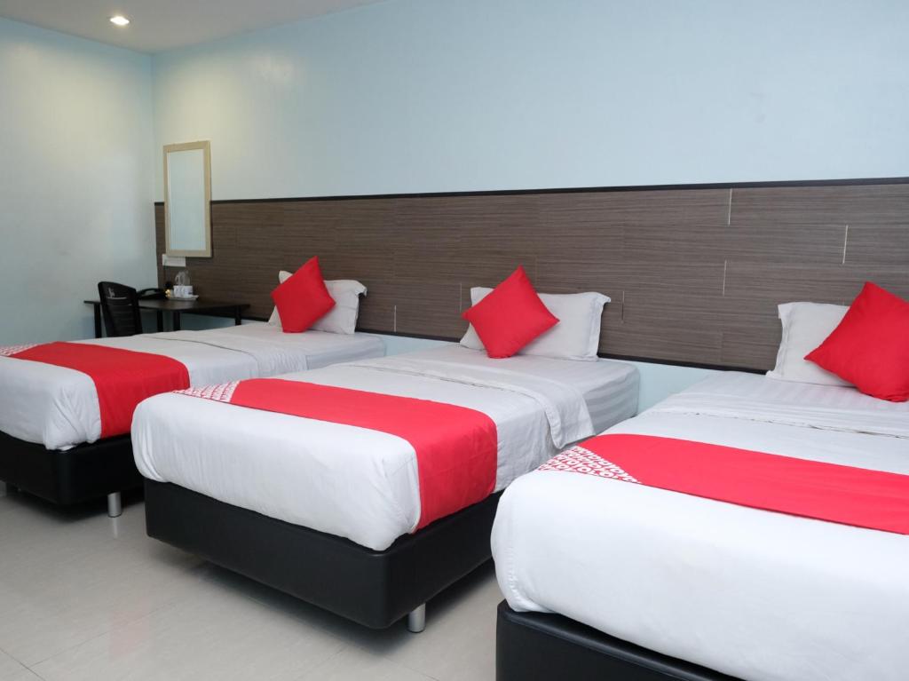 Postel nebo postele na pokoji v ubytování Hotel De' Tees, Masai Utama
