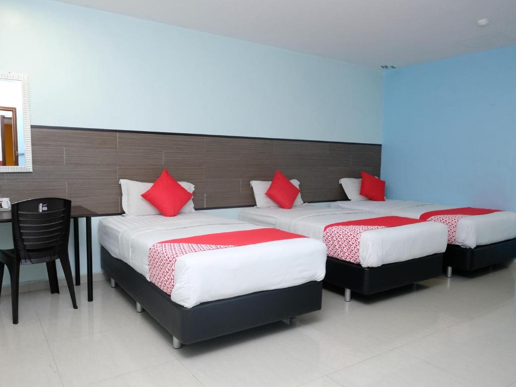 Postel nebo postele na pokoji v ubytování Hotel De' Tees, Masai Utama