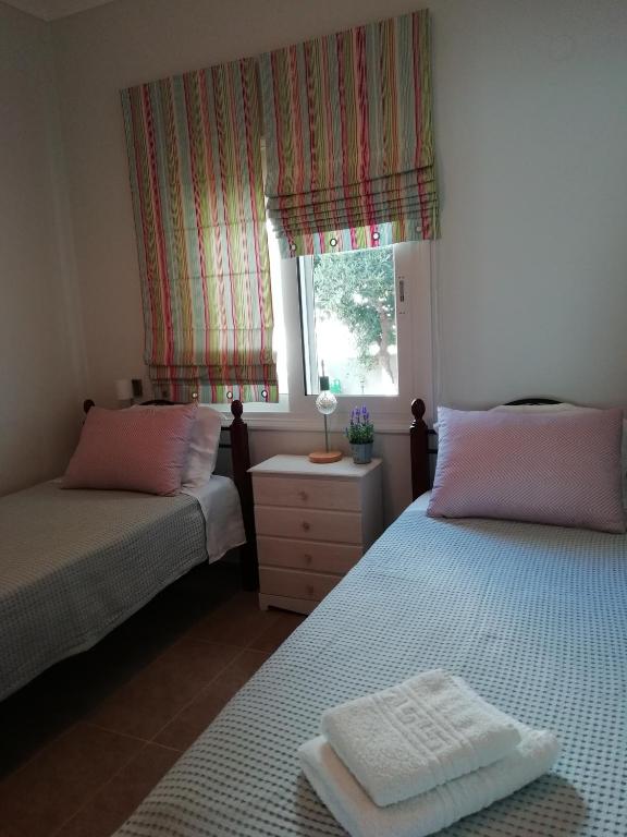 A bed or beds in a room at Dimitris' & Valentina's Home