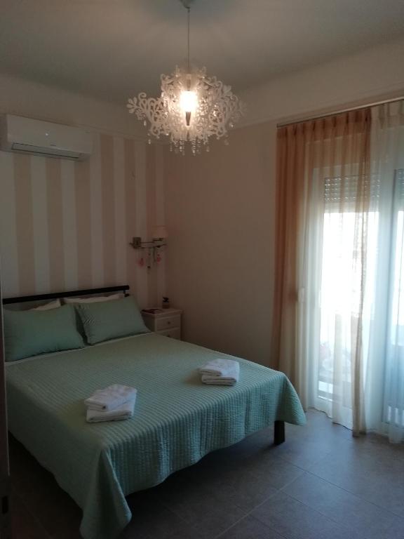 A bed or beds in a room at Dimitris' & Valentina's Home