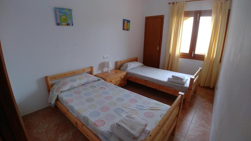 Кровать или кровати в номере Cala Mesquida