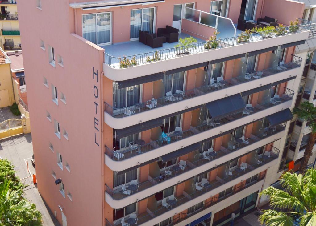 an aerial view of a pink building with balconies at Best Western Astoria in Juan-les-Pins