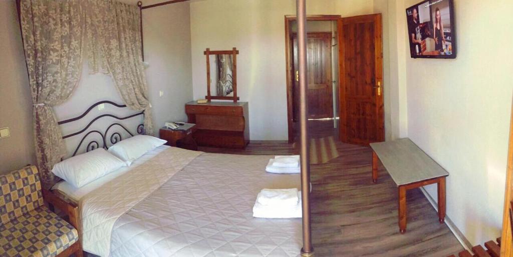 Postel nebo postele na pokoji v ubytování Lydia Hotel