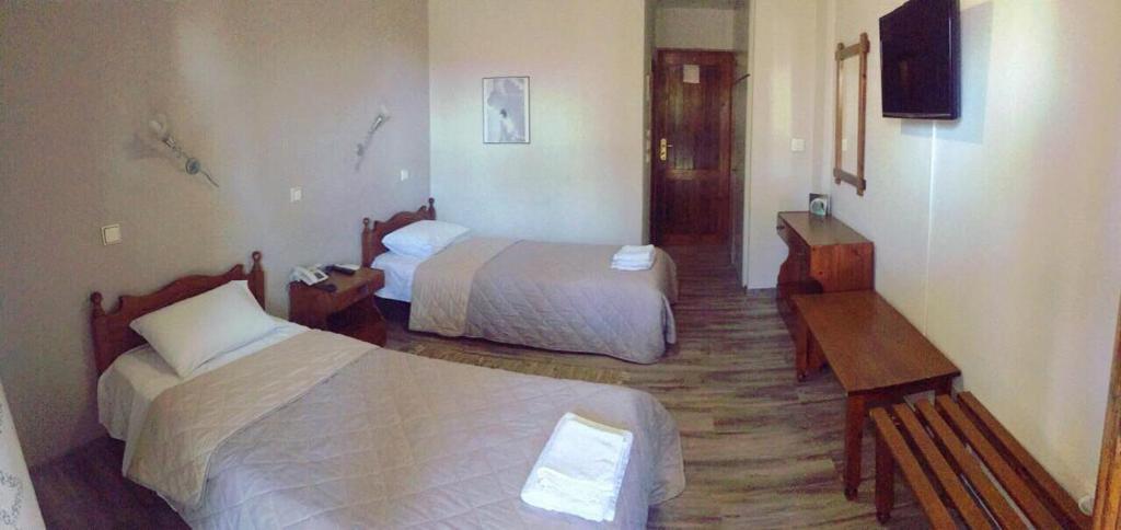 Postel nebo postele na pokoji v ubytování Lydia Hotel