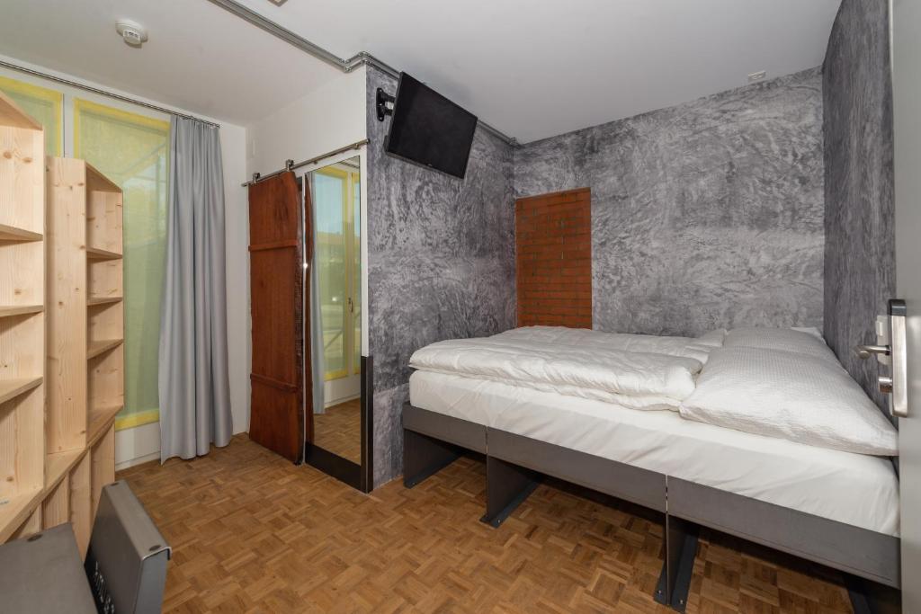 Postel nebo postele na pokoji v ubytování Boutique Hotel BS16 before Bern City Parking gratis