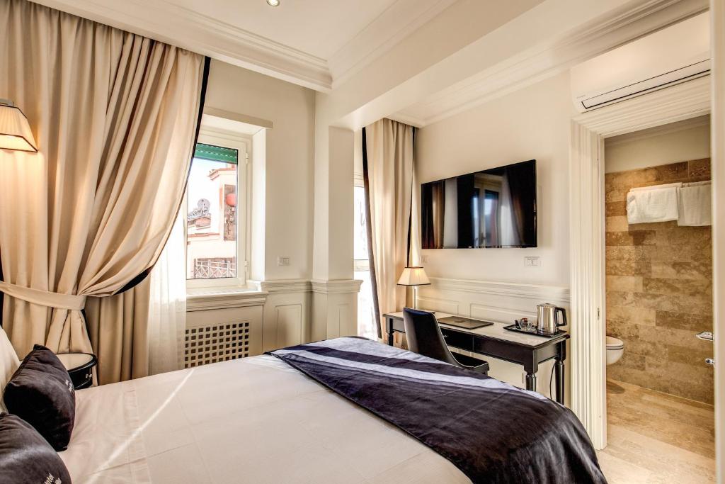 Postel nebo postele na pokoji v ubytování Hotel Domus Mea