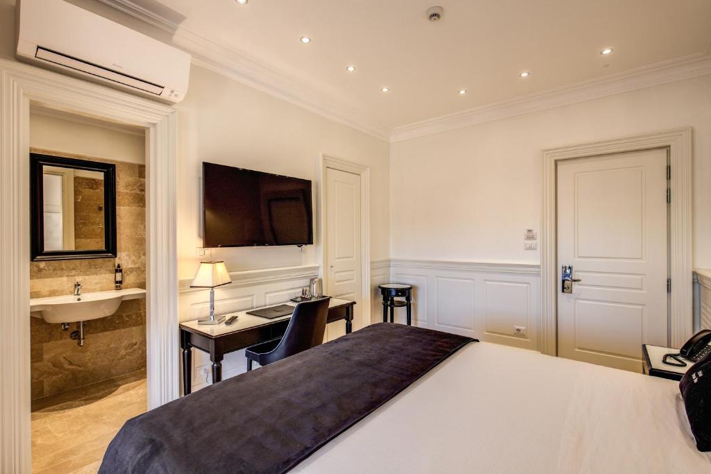 Postel nebo postele na pokoji v ubytování Hotel Domus Mea