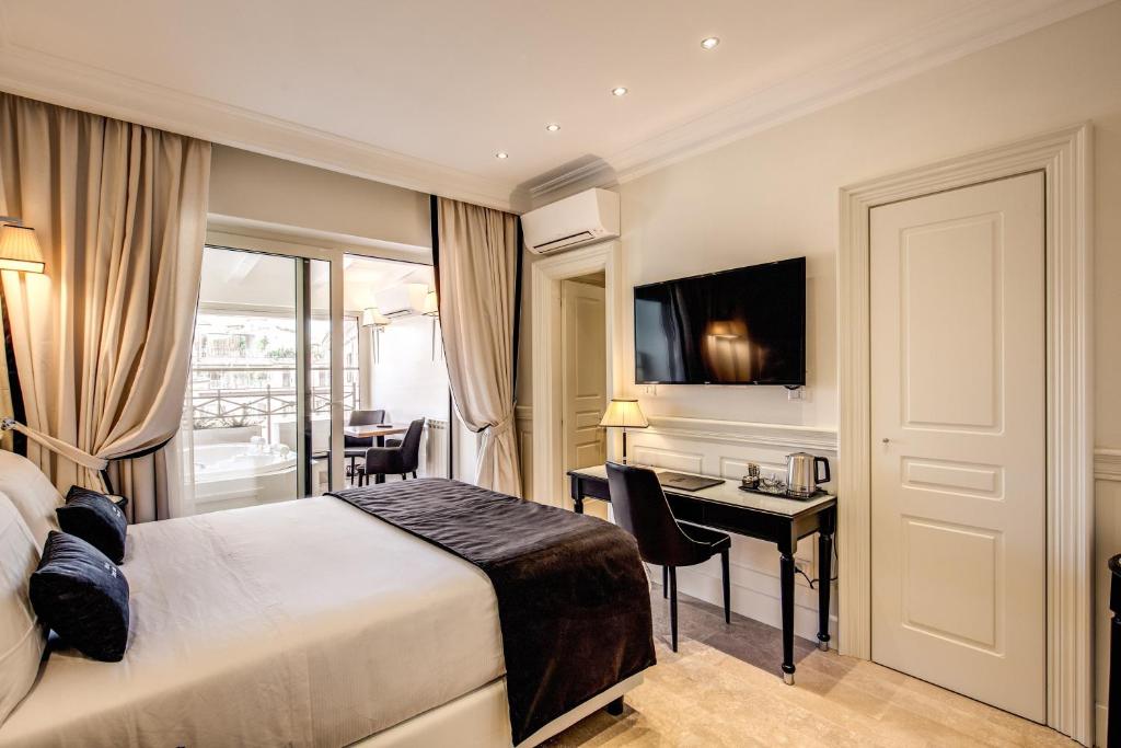 Postel nebo postele na pokoji v ubytování Hotel Domus Mea