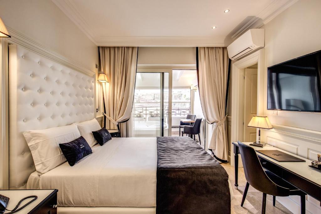 Postel nebo postele na pokoji v ubytování Hotel Domus Mea