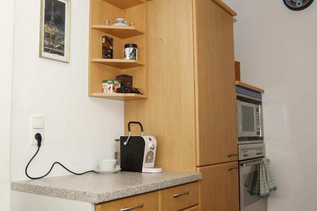 Kuchyň nebo kuchyňský kout v ubytování Stay-In Vienna 23
