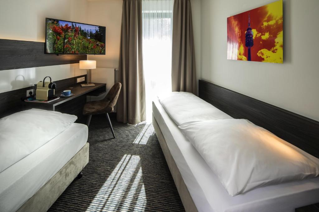 Postel nebo postele na pokoji v ubytování Hotel Südstern