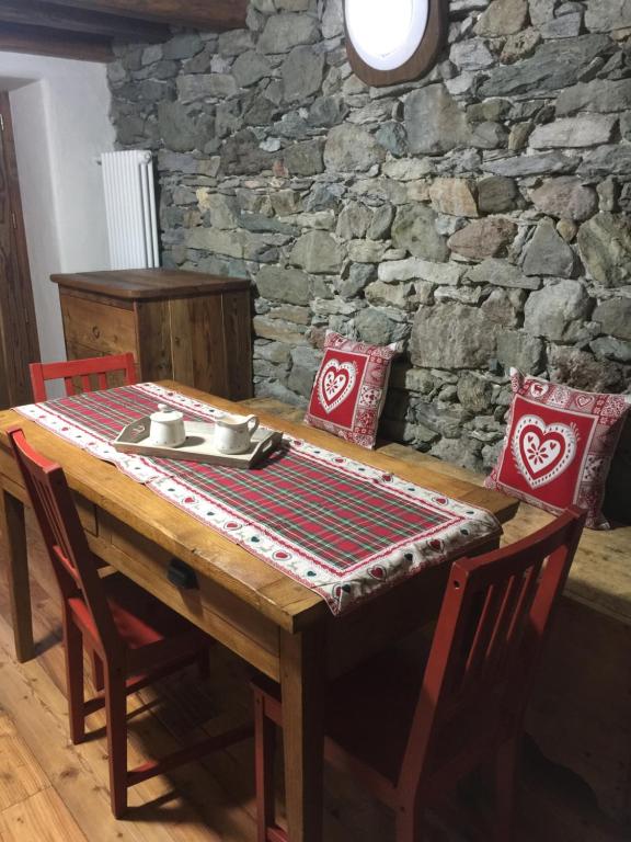 a wooden table with a table cloth on it at La Tzambretta in Aosta