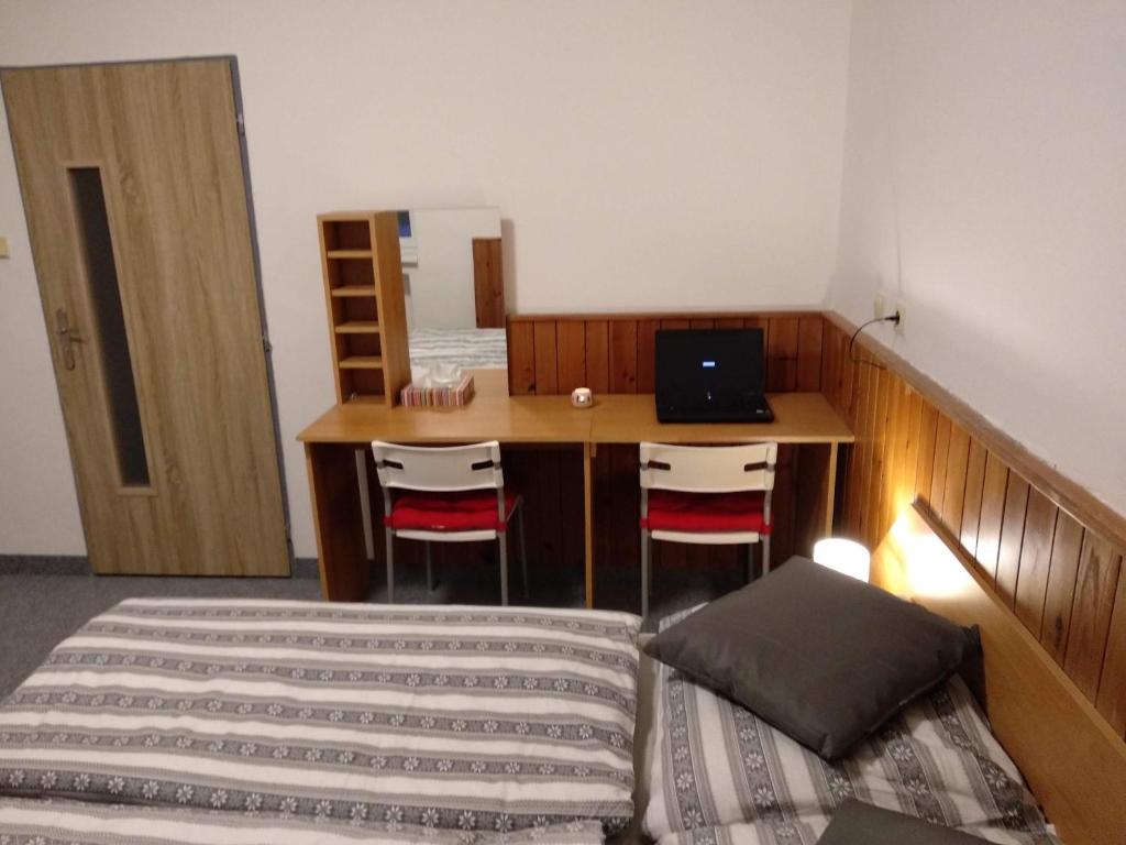 Postel nebo postele na pokoji v ubytování Prázdninový dům Na Panorámě