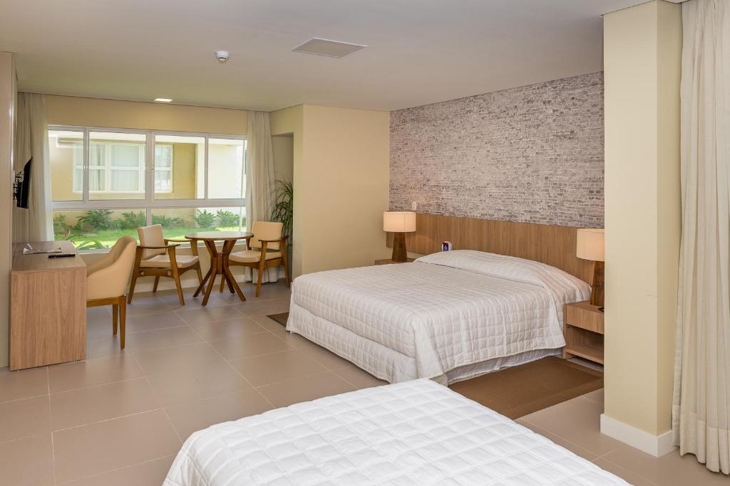 Cama ou camas em um quarto em Hotel Senac Barreira Roxa