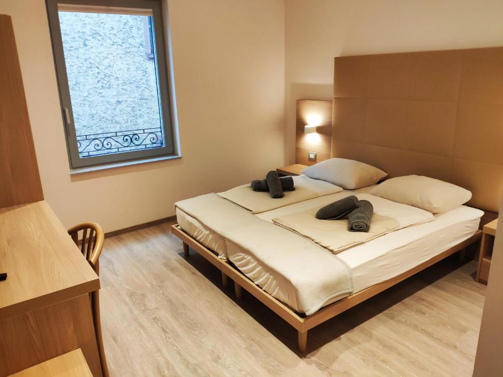 Postel nebo postele na pokoji v ubytování Kriemhilde Dependance