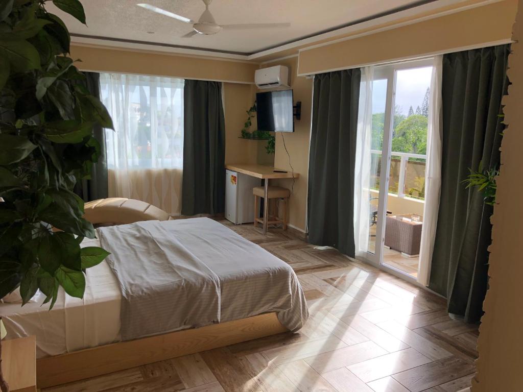 Postel nebo postele na pokoji v ubytování Sosua Inn Hotel