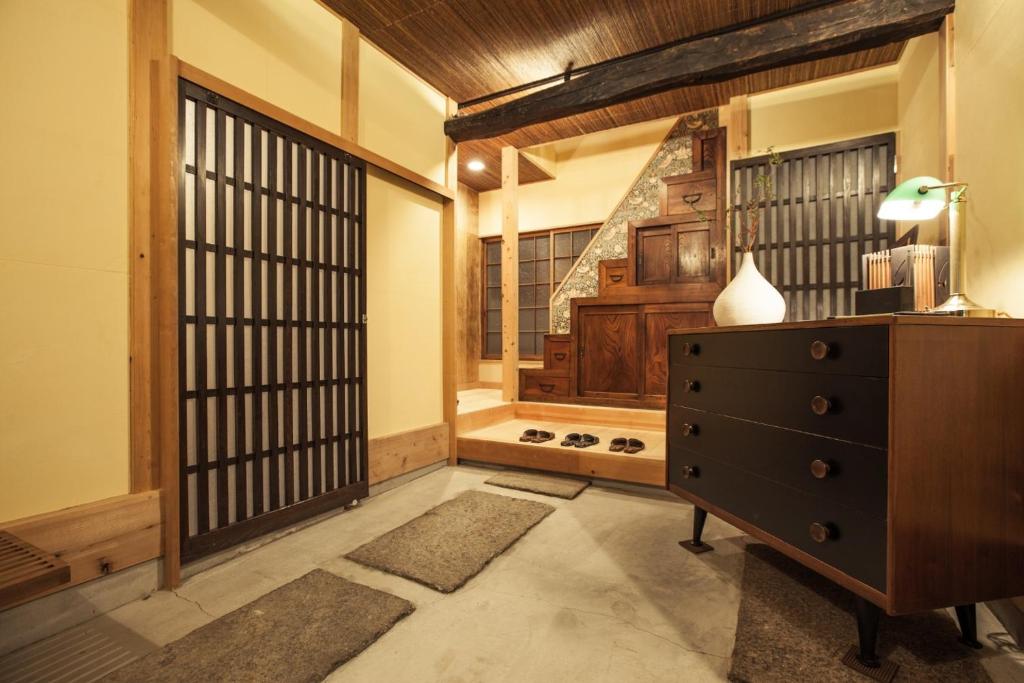 a room with a dresser and a large window at Minato-ku - House / Vacation STAY 12127 in Tokyo