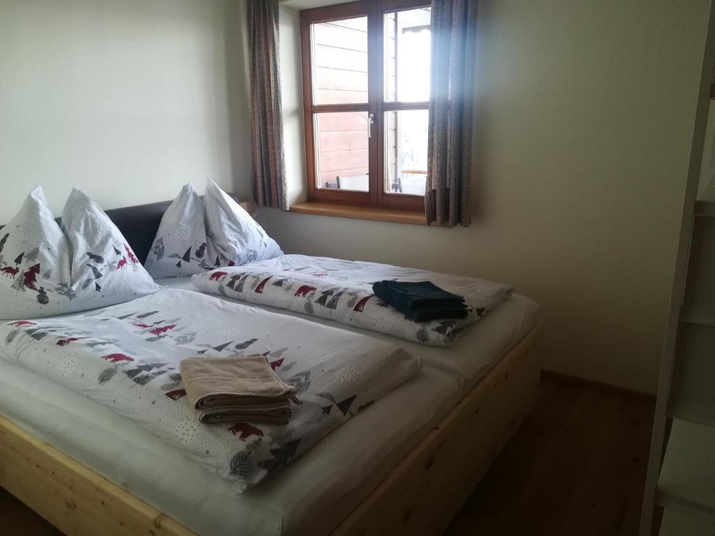 Postel nebo postele na pokoji v ubytování Apartments Susanne und Jasmin - Haus Sonnleitn