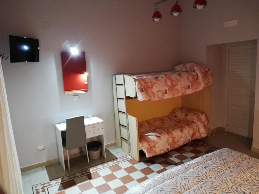 Postel nebo postele na pokoji v ubytování B&B Enjoy Ercolano