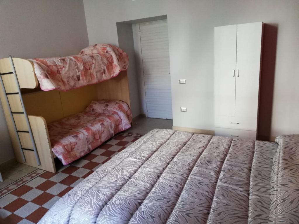 Postel nebo postele na pokoji v ubytování B&B Enjoy Ercolano
