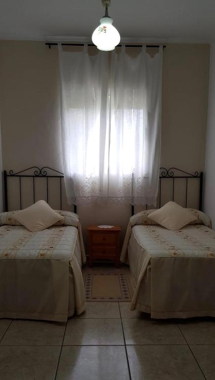 Cama o camas de una habitación en Casa Marta