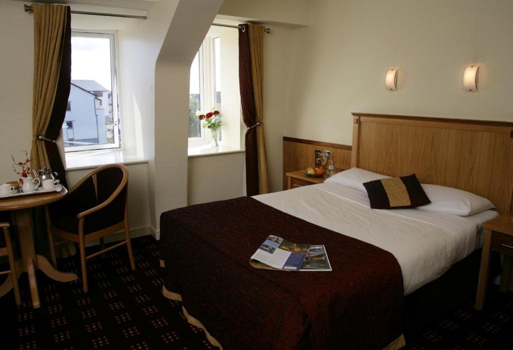 Postel nebo postele na pokoji v ubytování Bush Hotel