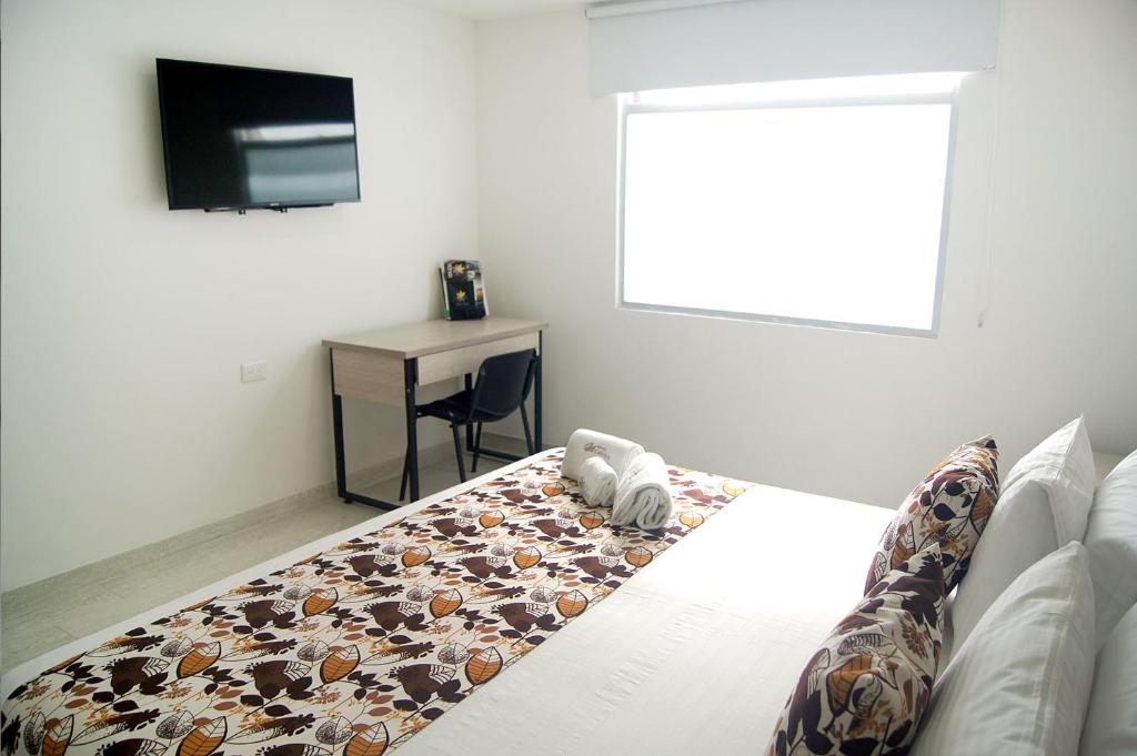 Postel nebo postele na pokoji v ubytování Hotel Cafeira