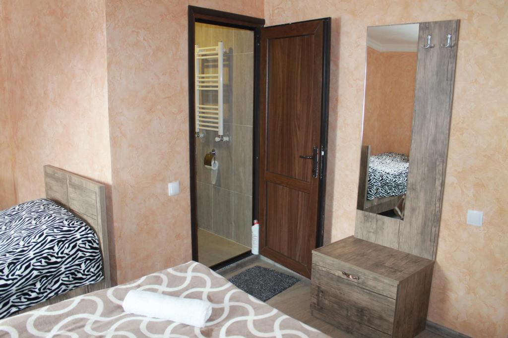 Postel nebo postele na pokoji v ubytování Maia's Guesthouse