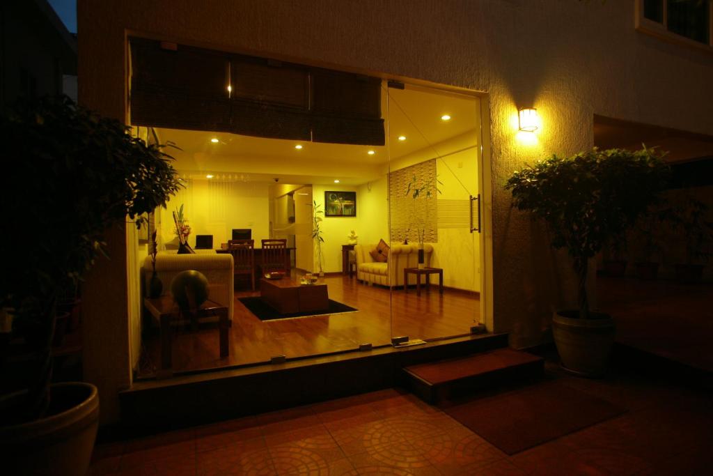 a view of a living room at night at juSTa Off MG Road in Bangalore