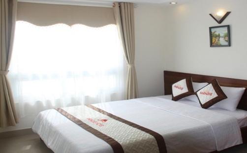 Postel nebo postele na pokoji v ubytování Paradise Hotel