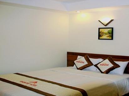Postel nebo postele na pokoji v ubytování Paradise Hotel