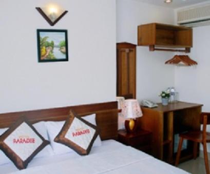 Postel nebo postele na pokoji v ubytování Paradise Hotel