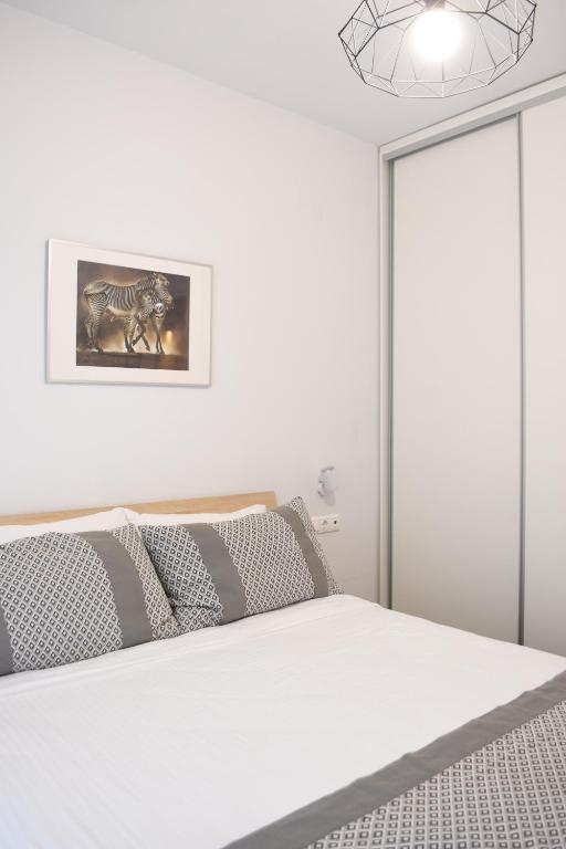 Posteľ alebo postele v izbe v ubytovaní Heliconia deluxe Apt Must