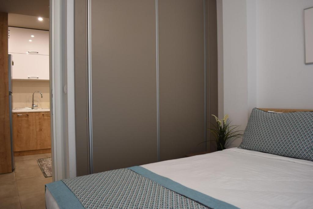 Posteľ alebo postele v izbe v ubytovaní Heliconia deluxe Apt Must