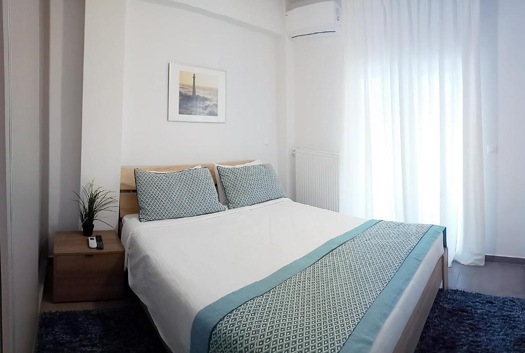 Posteľ alebo postele v izbe v ubytovaní Heliconia deluxe Apt Must