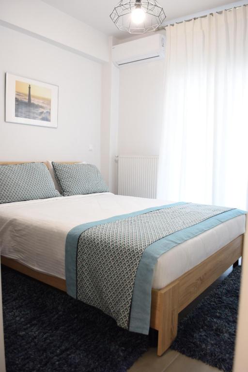 Posteľ alebo postele v izbe v ubytovaní Heliconia deluxe Apt Must